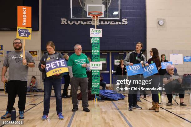 Supporters of Democratic presidential candidates former South Bend, Indiana Mayor Pete Buttigieg and Sen. Amy Klobuchar prepare to caucus for them in...