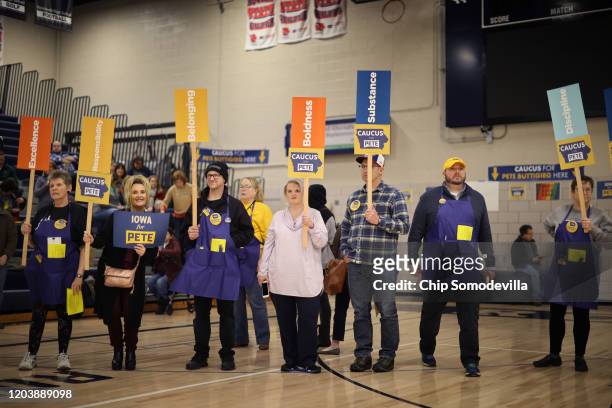 Supporters of Democratic presidential candidate Democratic presidential candidate former South Bend, Indiana Mayor Pete Buttigieg prepare to caucus...