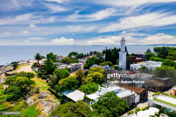 colonial street and houses at summer day. colonia del sacramento. uruguay. - local landmark imagens e fotografias de stock