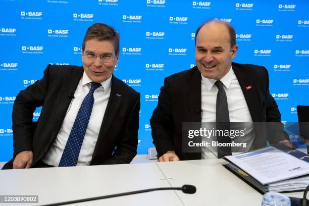 Hans-Ulrich Engel, chief financial officer of BASF SE, left, reacts with Martin Brudermueller, chief executive officer of BASF SE, during a full year...