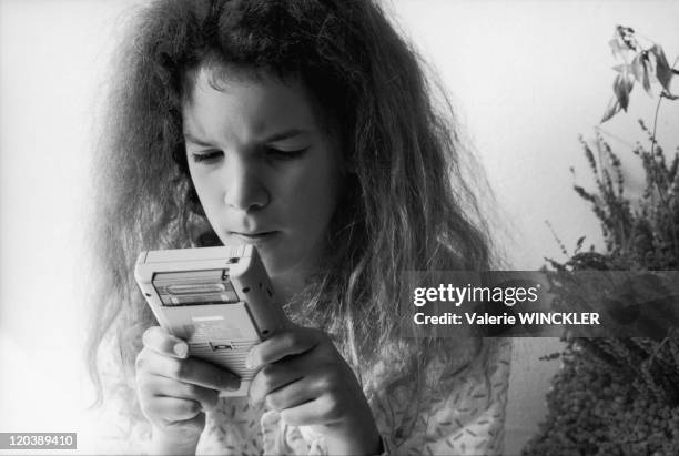 Constance - Playing gameboy.