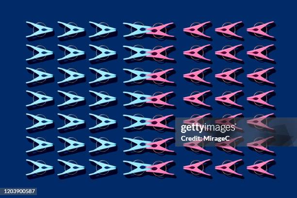 interlocked clothespins - compatibility stock pictures, royalty-free photos & images