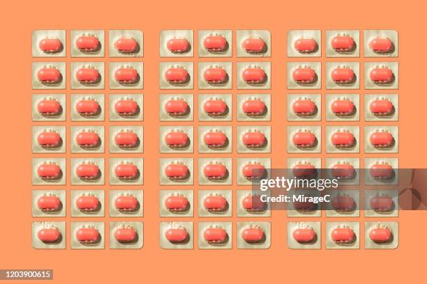 separated and neatly arranged blister packs - ibuprofen stock pictures, royalty-free photos & images