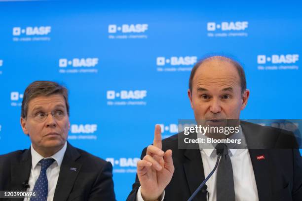 Martin Brudermueller, chief executive officer of BASF SE, right, gestures while speaking beside Hans-Ulrich Engel, chief financial officer of BASF...