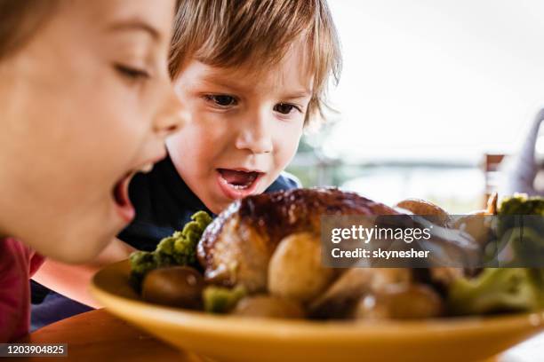 we are going to eat this all by ourselves! - sunday roast stock pictures, royalty-free photos & images
