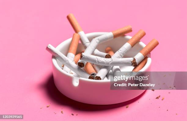 quitting smoking, broken cigarettes in ashtray - ashtray stock pictures, royalty-free photos & images