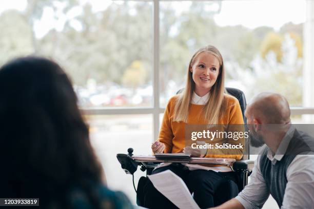 equal opportunities in business - wheelchair happy stock pictures, royalty-free photos & images