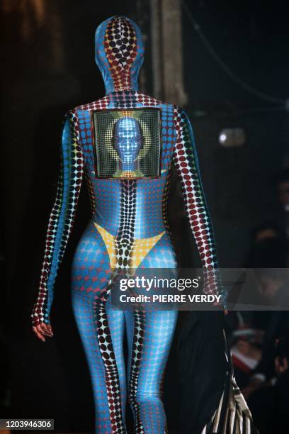 Model presents a Jean-Paul Gaultier's creation, a synthetic combinaison inspired by Vasarely, during the ready-to-wear Fall/Winter 1995/1996...