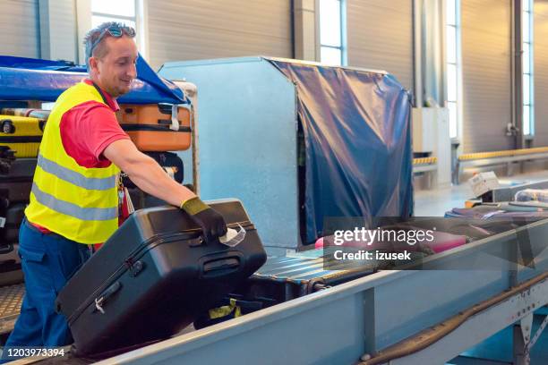 airport service crew unloading luggage - ground crew stock pictures, royalty-free photos & images