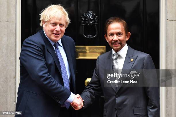 British Prime Minister Boris Johnson greets the Sultan of Brunei Hassanal Bolkiah during an official visit to Downing Street on February 04, 2020 in...