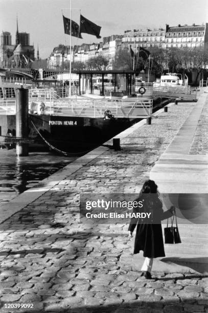 Quai Henry IV in Paris, France in 2002 - Little girl walking along the Seine river on quay Henri IV.