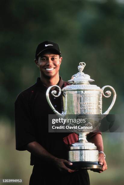 Tiger Woods of the United States holds the Wanamaker Trophy after winning the Professional Golfers' Association of America 82nd PGA Championship golf...