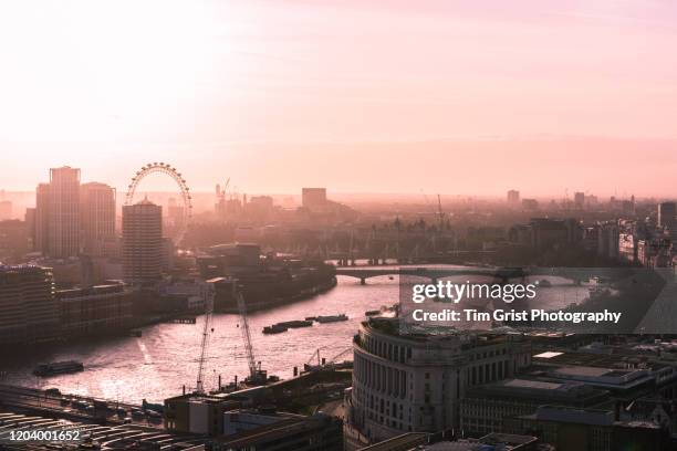an elevated view of sunset over the river thames and london skyline, uk - london eye aerial view stock pictures, royalty-free photos & images