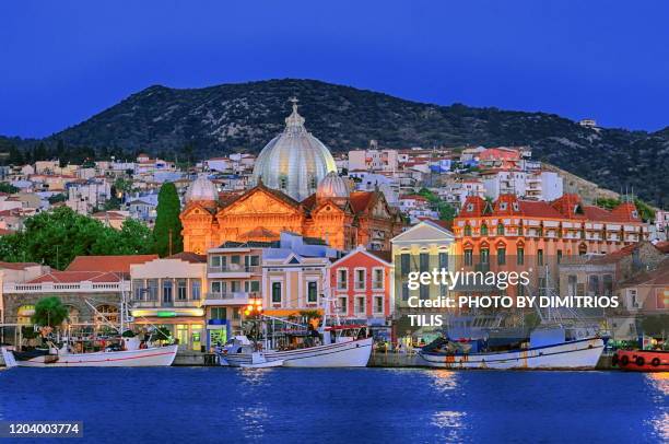 between night and day at mytilene's port 2 - mytilini stockfoto's en -beelden