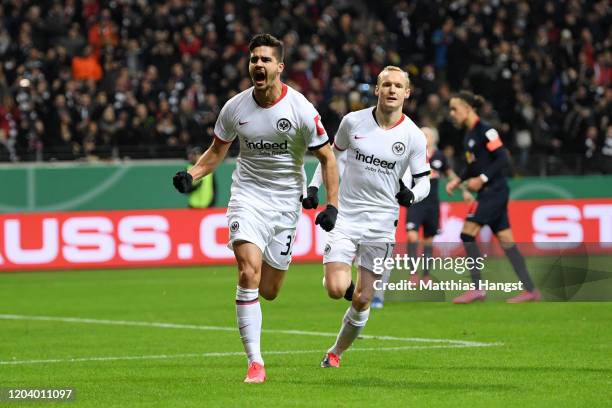 Andre Silva of Eintracht Frankfurt celebrates after scoring his team's first goal during the DFB Cup round of sixteen match between Eintracht...