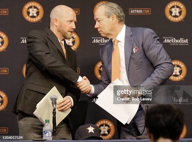 Houston Astros owner Jim Crane, right, shakes hands with new general manager James Click as the conclude a press conference introducing Click at...