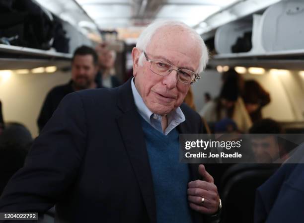 Democratic presidential candidate Sen. Bernie Sanders speaks to the media after boarding the plane at the Des Moines International Airport on...