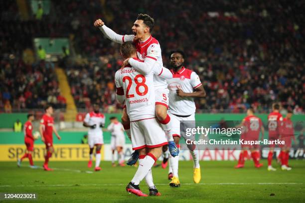 Rouwen Hennings of Fortuna Dusseldorf celebrates with Kaan Ayhan after scoring his team's fourth goal celebrates after scoring his team's fourth goal...