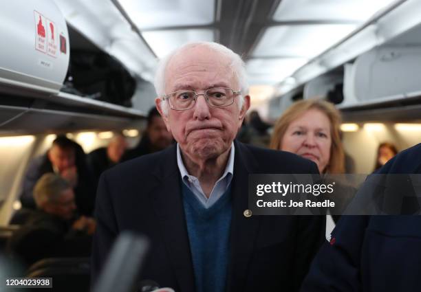 Democratic presidential candidate Sen. Bernie Sanders speaks to the media after boarding the plane at the Des Moines International Airport on...