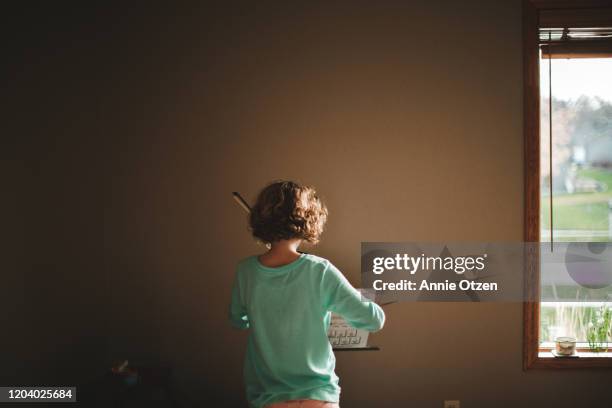 girl play an instrument with a bow - streicherbogen stock-fotos und bilder