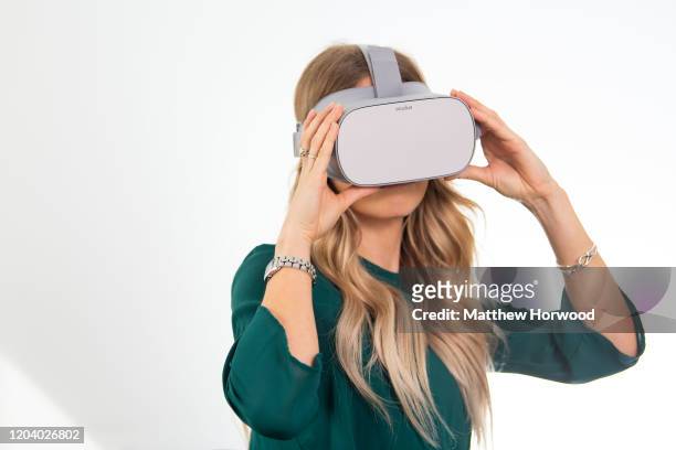 Woman uses a pair of virtual reality goggles on September 12, 2018 in Cardiff, United Kingdom.