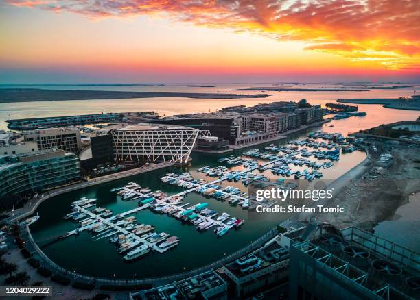 sunset over al marasy marina in abu dhabi, uae - abu dhabi stock pictures, royalty-free photos & images