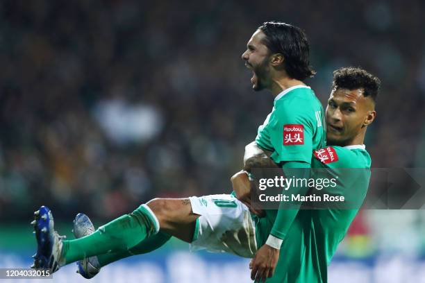 Leonardo Bittencourt of SV Werder Bremen celebrates with Davie Selke after scoring his team's second goal during the DFB Cup round of sixteen match...