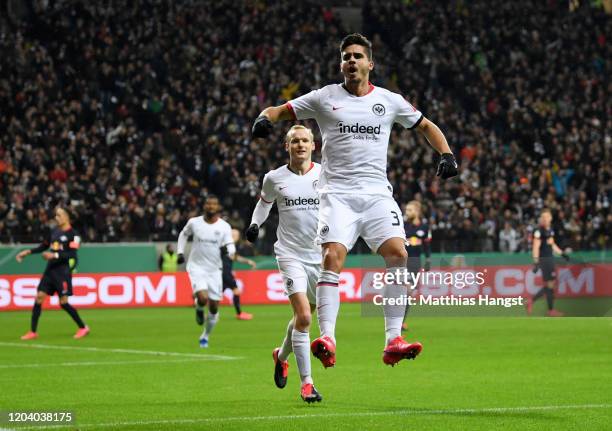 Andre Silva of Eintracht Frankfurt celebrates after scoring his team's first goal during the DFB Cup round of sixteen match between Eintracht...