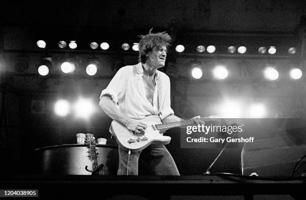 English Rock & Pop musician Ray Davies, of the group the Kinks, plays guitar as he performs onstage during the Dr Pepper Central Park Music Festival,...