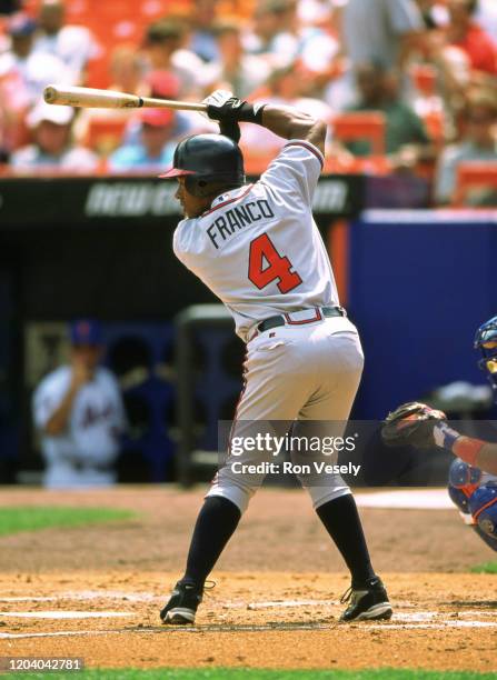 Julio Franco of the Atlanta Braves bats during an MLB game at Shea Stadium in Flushing, New York. Franco played for 23 seasons, with 8 different...