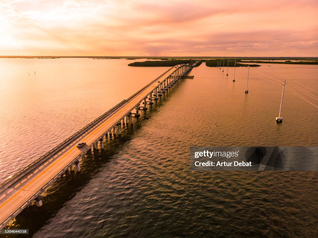Drone view of the Overseas Highway in Florida Keys during sunset.