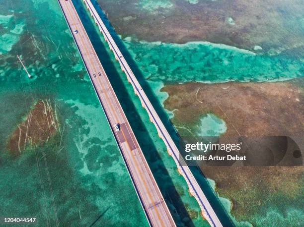 directly above view of the overseas highway in florida keys with turquoise watercolor. - overseas highway stock pictures, royalty-free photos & images