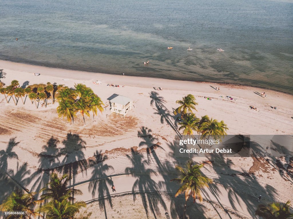 Drone view of the Crandon Park Key Biscayne beach with lifeguard hut.