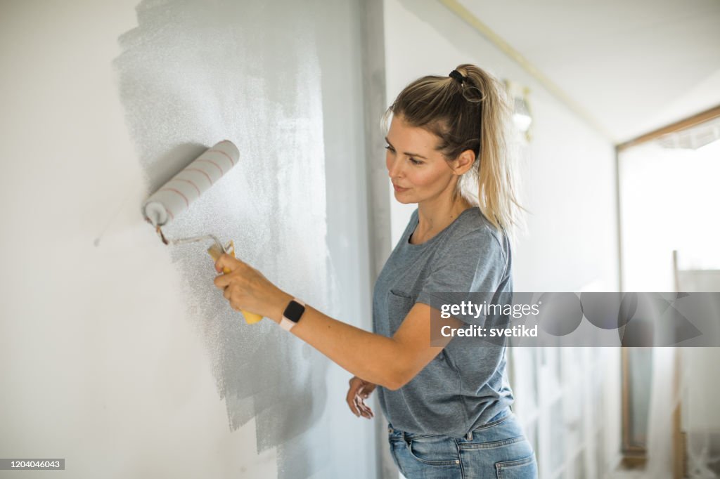 Woman doing diy project in apartment