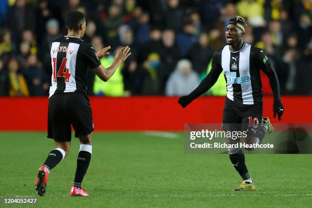 Allan Saint-Maximin of Newcastle United celebrates with Isaac Hayden after scoring his team's third goal during the FA Cup Fourth Round Replay match...