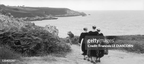 Sizun, Brittany,France - Young Breton girls in traditional costumes from the Baud area of Brittany during the Ajoncs festival, Beuzec-Cap Sizun, in...
