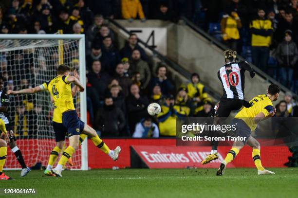 Allan Saint-Maximin of Newcastle United FC scores the winning goal in extra time during the FA Cup Fourth Round Replay match between Oxford United...