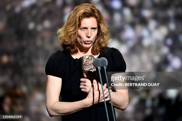 French cinematographer Claire Mathon delivers a speech on stage after she won the Best Cinematographer award for "Portrait de la jeune fille en feu "...
