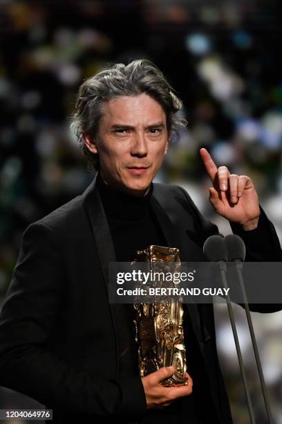 French actor Swann Arlaud delivers a speech on stage after he won the Best Actor in a Supporting Role award for "Grace a Dieu " during the 45th...