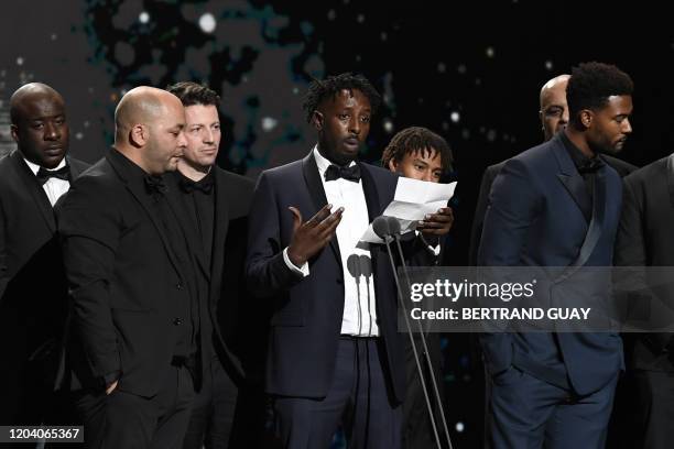 French director Ladj Ly delivers a speech on stage after "Les Miserables" won the Best Feature Film award during the 45th edition of the Cesar Film...