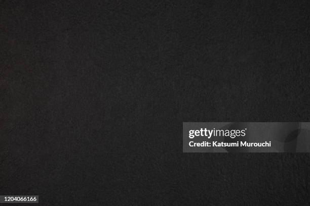 patterned black paper texture background - schwarz stock-fotos und bilder