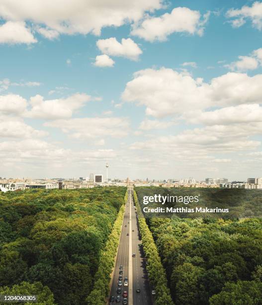 berlin modern urban green summer skyline city over the tiergarten with traffic and cloudscape - berlin city stockfoto's en -beelden