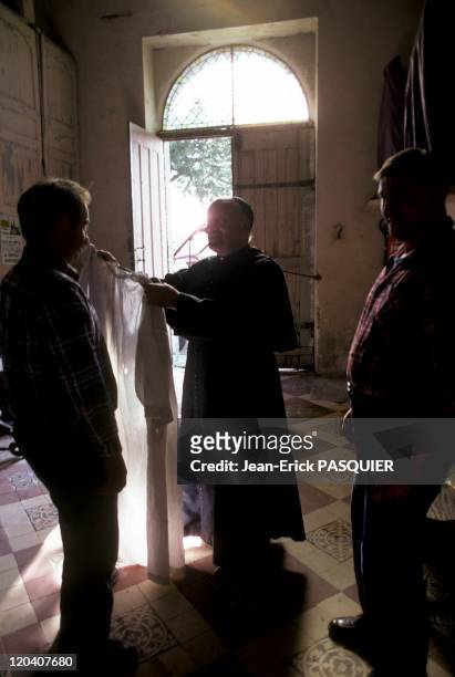 The Priest And His Aides In France In 1987 - The farmers are also involved in the neighborhood and with joy at the Sunday mass-a Country Priest:...