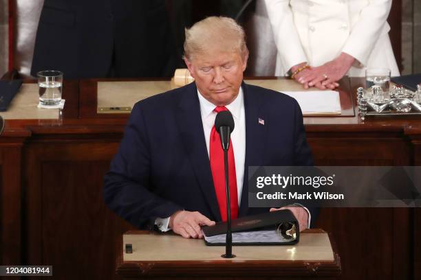 President Donald Trump steps to the lectern for the State of the Union address in the chamber of the U.S. House of Representatives on February 04,...