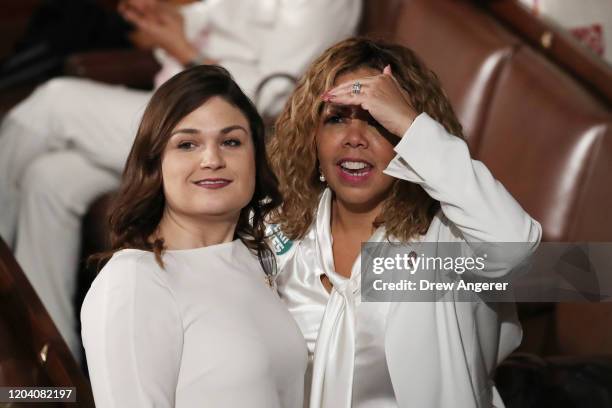 Rep Abby Finkenauer and Rep. Lucy McBath attend the State of the Union address in the chamber of the U.S. House of Representatives on February 04,...