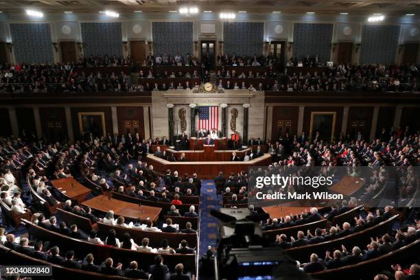 President Donald Trump delivers the State of the Union address House Speaker Rep. Nancy Pelosi and Vice President Mike Pence look on in the chamber...