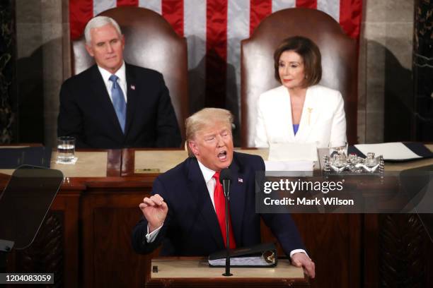 President Donald Trump delivers the State of the Union address House Speaker Rep. Nancy Pelosi and Vice President Mike Pence look on in the chamber...