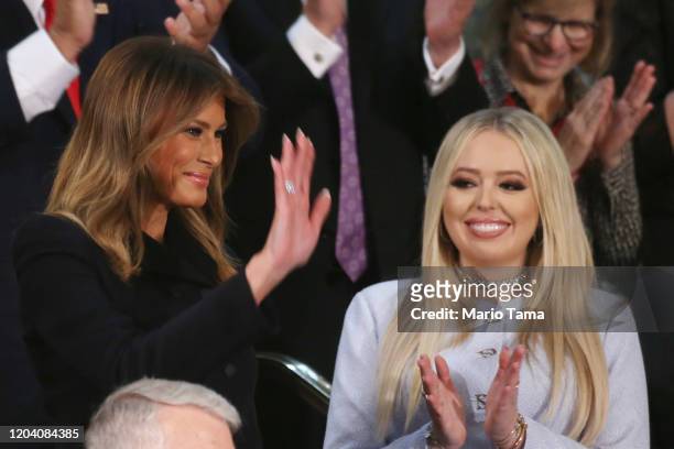 First Lady Melania Trump waves from the First Lady's box as Tiffany Trump looks on during the State of the Union address in the chamber of the U.S....