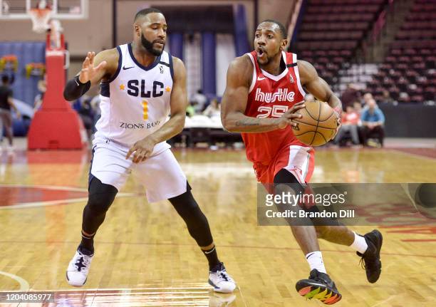 Marquis Teague of the Memphis Hustle drives against Deonte Burton of the Salt Lake City Stars in an NBA G-League game on February 28, 2020 at Landers...