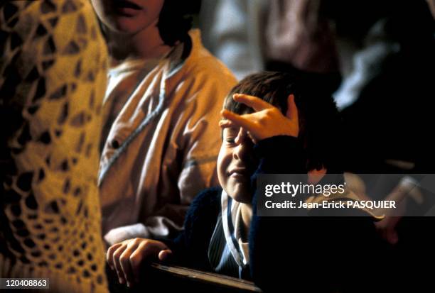Young Parishioner In France In 1987 - A young parishioner gets distracted by his thoughts and does not seem to pay much attention to the conduct of...